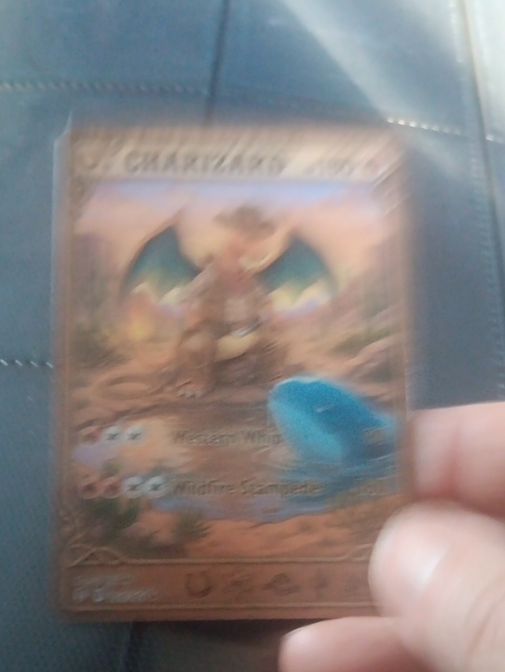 Pokemon Card Featuring Blue Creature and Brown Frame